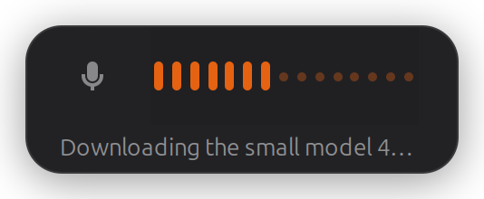 The whisper-desk overlay while the model downloads